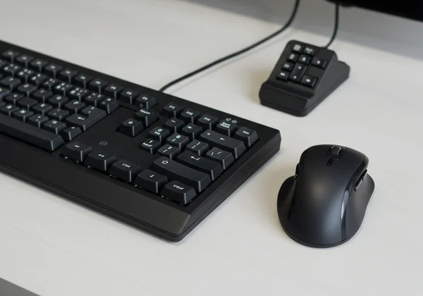 Close-up of an ergonomic split keyboard and vertical mouse.